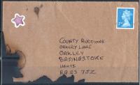 2011 Charred cover, result of pillar box fire, unusual