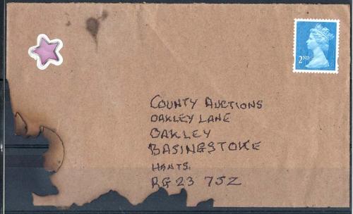 2011 Charred cover, result of pillar box fire, unusual